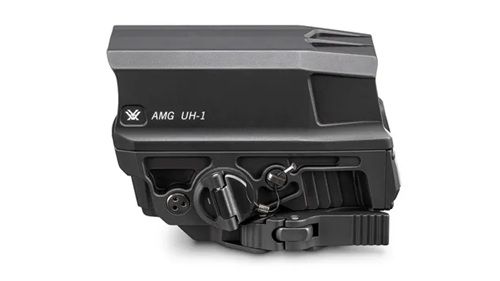 A side view of a Vortex AMG UH-1 holographic sight, featuring a sleek black design with various controls and connectors.